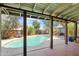 View of the pool from the covered patio, offering a refreshing outdoor oasis at 1749 W Monterosa St, Phoenix, AZ 85015
