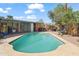 Backyard pool surrounded by lush landscaping offers a private retreat for relaxation and entertainment at 1749 W Monterosa St, Phoenix, AZ 85015