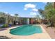 Backyard pool surrounded by lush landscaping offers a private retreat for relaxation and entertainment at 1749 W Monterosa St, Phoenix, AZ 85015