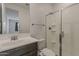 Stylish bathroom featuring a glass shower, modern fixtures, and a sleek vanity at 17704 W Fetlock Trl, Surprise, AZ 85387
