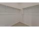 Walk-in closet with shelving and carpeted flooring at 17704 W Fetlock Trl, Surprise, AZ 85387