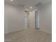 Hallway features wood-look flooring, recessed lighting, and neutral paint at 17704 W Fetlock Trl, Surprise, AZ 85387