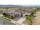 Stunning aerial view of home showcasing desert landscaping, tile roof, and multi-car garage in a beautiful community at 19026 W Becker Ln, Surprise, AZ 85388
