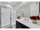 Bathroom features a glass shower and dark vanity at 19026 W Becker Ln, Surprise, AZ 85388