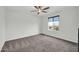 Relaxing carpeted bedroom with a window and neutral walls at 19026 W Becker Ln, Surprise, AZ 85388