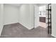 A cozy bedroom provides a calming atmosphere with neutral walls and soft carpeting at 19026 W Becker Ln, Surprise, AZ 85388