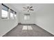 Bright, spacious bedroom with a ceiling fan, neutral walls, and window coverings at 19026 W Becker Ln, Surprise, AZ 85388