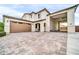 Wide driveway leading to multi-car garage featuring a unique, covered parking area with ample space at 19026 W Becker Ln, Surprise, AZ 85388