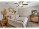 Comfortable bedroom with a ceiling fan, area rug, and decorative wall art at 19039 N 47Th Ave, Glendale, AZ 85308