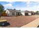 Charming single-story home with a low maintenance desert landscape and gray roof at 19039 N 47Th Ave, Glendale, AZ 85308