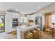 Bright kitchen featuring white cabinetry, stainless steel appliances, and a large island with seating at 19039 N 47Th Ave, Glendale, AZ 85308