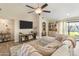 Comfortable living room featuring a large sectional sofa and natural light at 19039 N 47Th Ave, Glendale, AZ 85308