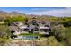 Breathtaking aerial view of luxurious property featuring a pool, manicured grounds, and mountain views at 19296 N 98Th Pl, Scottsdale, AZ 85255