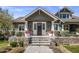 Charming front entrance with stone steps, decorative planters, and a welcoming, stylish front door at 19296 N 98Th Pl, Scottsdale, AZ 85255