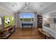 Spacious game room with foosball table, comfortable seating, and natural light at 19296 N 98Th Pl, Scottsdale, AZ 85255