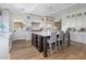 Spacious kitchen features a large center island with marble countertops and white cabinets at 19296 N 98Th Pl, Scottsdale, AZ 85255