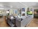 Elegant living room with a fireplace, built-in shelving, and comfortable seating, perfect for relaxation at 19296 N 98Th Pl, Scottsdale, AZ 85255