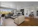 Spacious living room with a seamless indoor-outdoor connection and views of the manicured backyard at 19296 N 98Th Pl, Scottsdale, AZ 85255