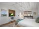 Light and airy bedroom with built-in storage and a seating area by the window at 19296 N 98Th Pl, Scottsdale, AZ 85255