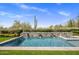 Stunning pool with stone detailing and water features creates a serene and luxurious desert retreat at 19296 N 98Th Pl, Scottsdale, AZ 85255