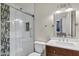 Bright bathroom featuring glass shower with decorative tile and wood vanity at 195 N Cottonwood St # 26, Chandler, AZ 85225