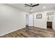 Bedroom featuring wood-look flooring, modern ceiling fan and closet access at 195 N Cottonwood St # 26, Chandler, AZ 85225