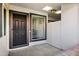 Inviting entryway with a modern black front door and a window that adds natural light to the space at 195 N Cottonwood St # 26, Chandler, AZ 85225