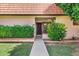Inviting front entrance with well-manicured bushes and a walkway leading to a dark-colored front door at 195 N Cottonwood St # 26, Chandler, AZ 85225