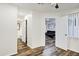 Hallway that connects to multiple rooms, has wood-look floors and white walls at 195 N Cottonwood St # 26, Chandler, AZ 85225
