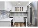 Updated kitchen boasting sleek white cabinets, modern appliances, and a stylish backsplash for a contemporary feel at 195 N Cottonwood St # 26, Chandler, AZ 85225