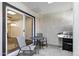Covered patio area with outdoor grill, table, and chairs at 195 N Cottonwood St # 26, Chandler, AZ 85225