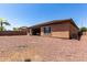 Spacious backyard with a covered patio, providing ample outdoor living space at 1955 E Grand Canyon Dr, Chandler, AZ 85249