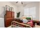 Cozy bedroom with a gold bed frame, side table, and natural light from a window at 1955 E Grand Canyon Dr, Chandler, AZ 85249