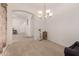 Cozy dining area with tile floors, chandelier lighting, and an arched entryway at 1955 E Grand Canyon Dr, Chandler, AZ 85249