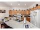 Spacious kitchen with a breakfast bar, oak cabinetry, and stainless steel appliances at 1955 E Grand Canyon Dr, Chandler, AZ 85249