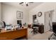 Home office with a large desk, a ceiling fan, and neutral carpeting at 1955 E Grand Canyon Dr, Chandler, AZ 85249