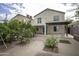 Spacious backyard with a patio, mature trees, and a pergola attached to the house at 20221 N 31St St, Phoenix, AZ 85050