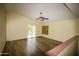 Upstairs bonus room with laminate floors and sliding glass door at 20221 N 31St St, Phoenix, AZ 85050