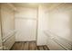 Walk-in closet with metal shelving and wood floor at 20221 N 31St St, Phoenix, AZ 85050