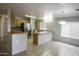 Kitchen features wood cabinets, stainless steel appliances, tile floors and a bar at 20221 N 31St St, Phoenix, AZ 85050
