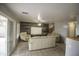 Open living room area boasts tile flooring, sliding glass door, and neutral-toned furniture at 20221 N 31St St, Phoenix, AZ 85050