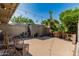 Backyard patio with outdoor seating under string lights, desert landscaping, and privacy wall at 2041 W Pierson St, Phoenix, AZ 85015