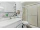Simple bathroom with a vanity, a mirror, and a glass enclosed shower at 2041 W Pierson St, Phoenix, AZ 85015