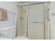 Bathroom featuring a shower with frosted glass doors, toilet, and towel rack at 2041 W Pierson St, Phoenix, AZ 85015
