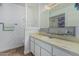 Bathroom vanity with marble countertop, sink, and decorative mirror on a lattice wall at 2041 W Pierson St, Phoenix, AZ 85015
