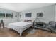 Relaxing bedroom featuring tiled floors, a ceiling fan, and lots of natural light at 2041 W Pierson St, Phoenix, AZ 85015