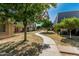Scenic pathway through the community, lined with lush trees at 2041 W Pierson St, Phoenix, AZ 85015