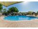 Large community pool with sunshades, lounge chairs and disability access at 2041 W Pierson St, Phoenix, AZ 85015