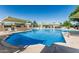 Large community pool with sunshades, lounge chairs and disability access at 2041 W Pierson St, Phoenix, AZ 85015