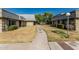 Community's sidewalk with landscaped lawns between buildings at 2041 W Pierson St, Phoenix, AZ 85015